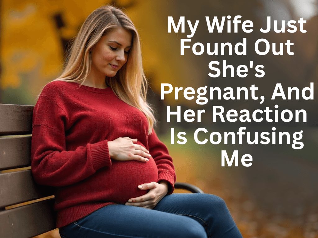 A beautiful, blonde woman in a red sweater and jeans sits on a park bench, looking down and gently holding her pregnant belly. The image is overlayed with text that reads, "My Wife Just Found Out She's Pregnant, And Her Reaction Is Confusing Me."